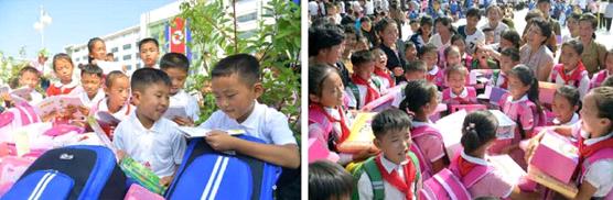 사랑의 선물을 받아안는 수해지역의 학령전어린이들과 학생들 사랑의 선물을 받아안는 수해지역의 학령전어린이들과 학생들