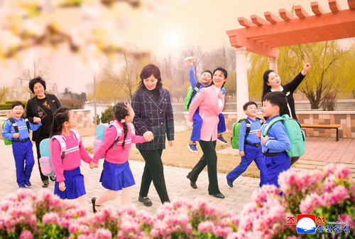 Students and their parents who are happy to receive the new school uniforms associated with the fatherly love