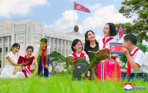 Students and their parents who are happy to receive the new school uniforms associated with the fatherly love