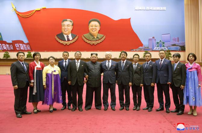 Supreme Leader Kim Jong Un Has Photo Session with Participants in 14th National Conference of Teachers